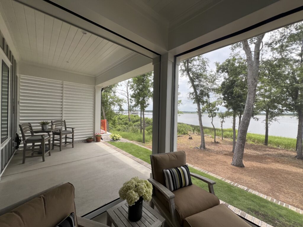 Cozy patio overlooking lake and tree-lined view