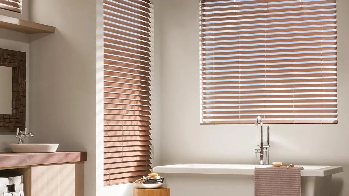 Modern bathroom with wooden blinds and bathtub